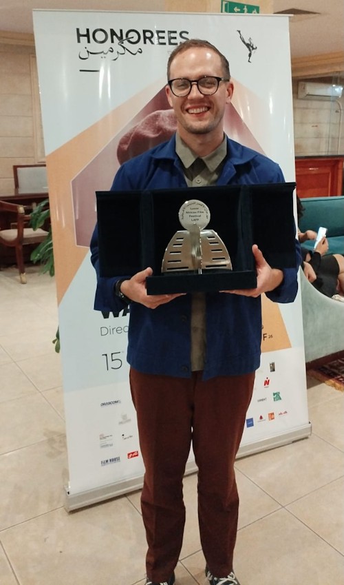 Michael James with his award the Radwan El Kashef Prize for Best Film Addressing an African Issue